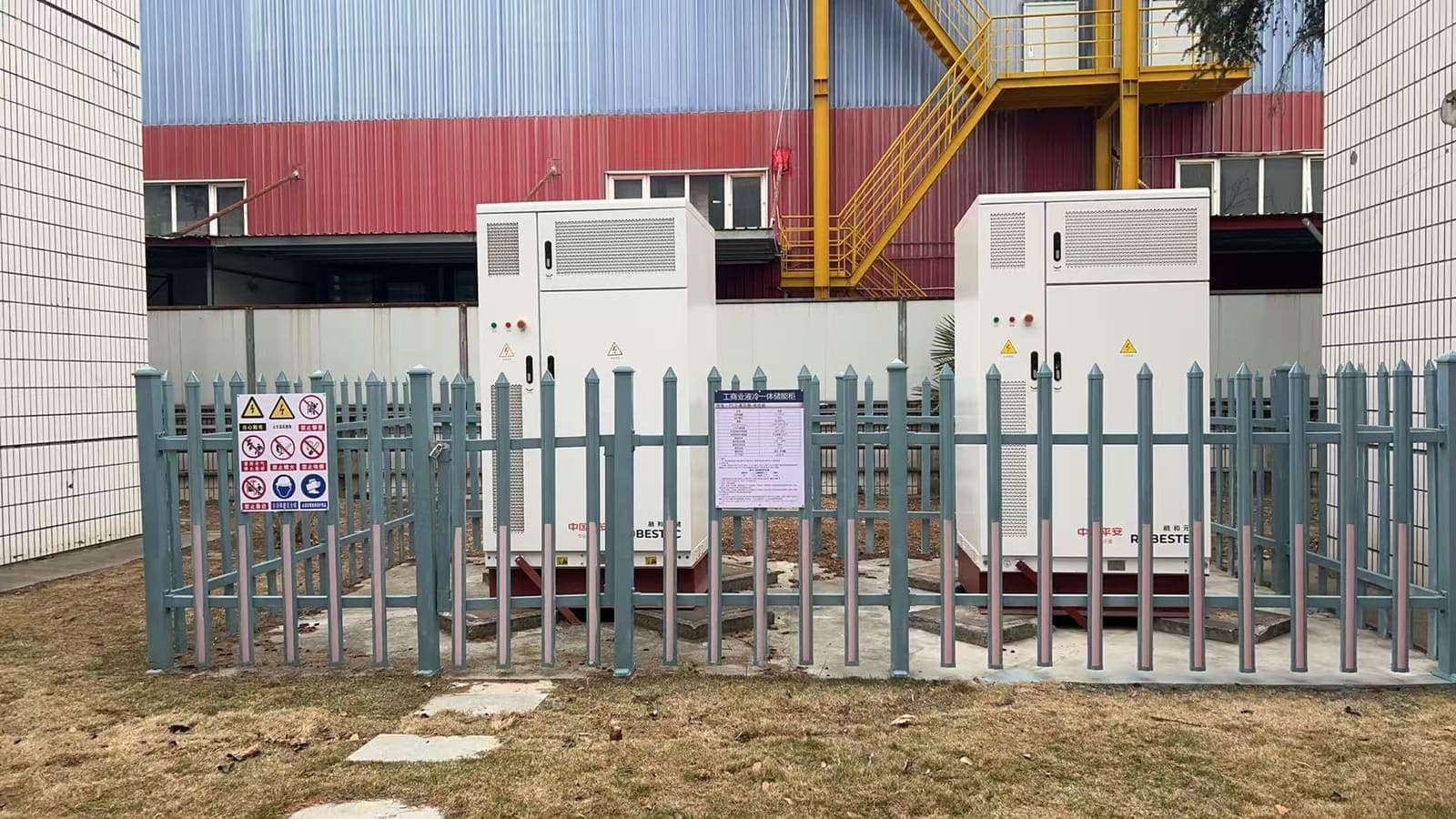 Commercial battery energy storage cabinets installed at an industrial solar project site