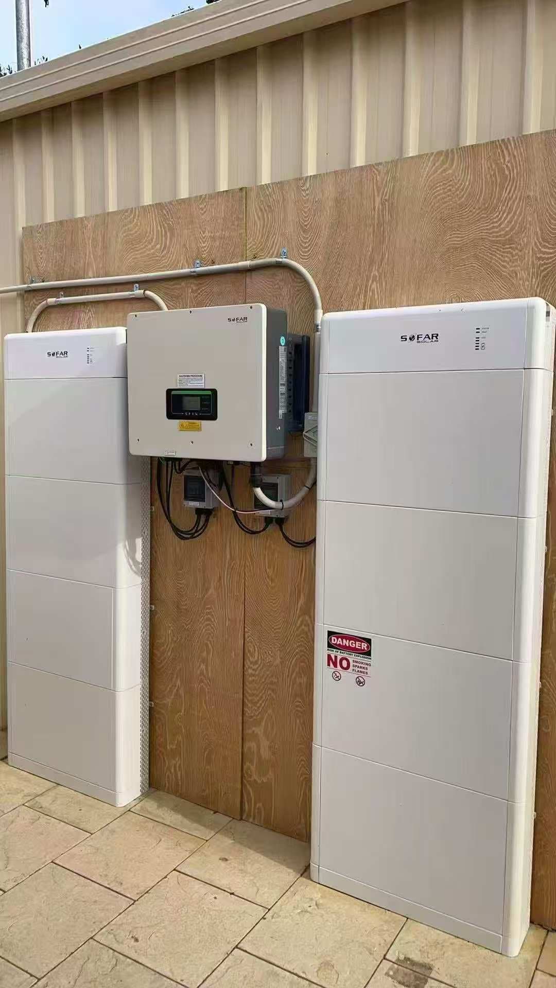 SOFAR hybrid inverter with twin battery towers installed outside a residential property