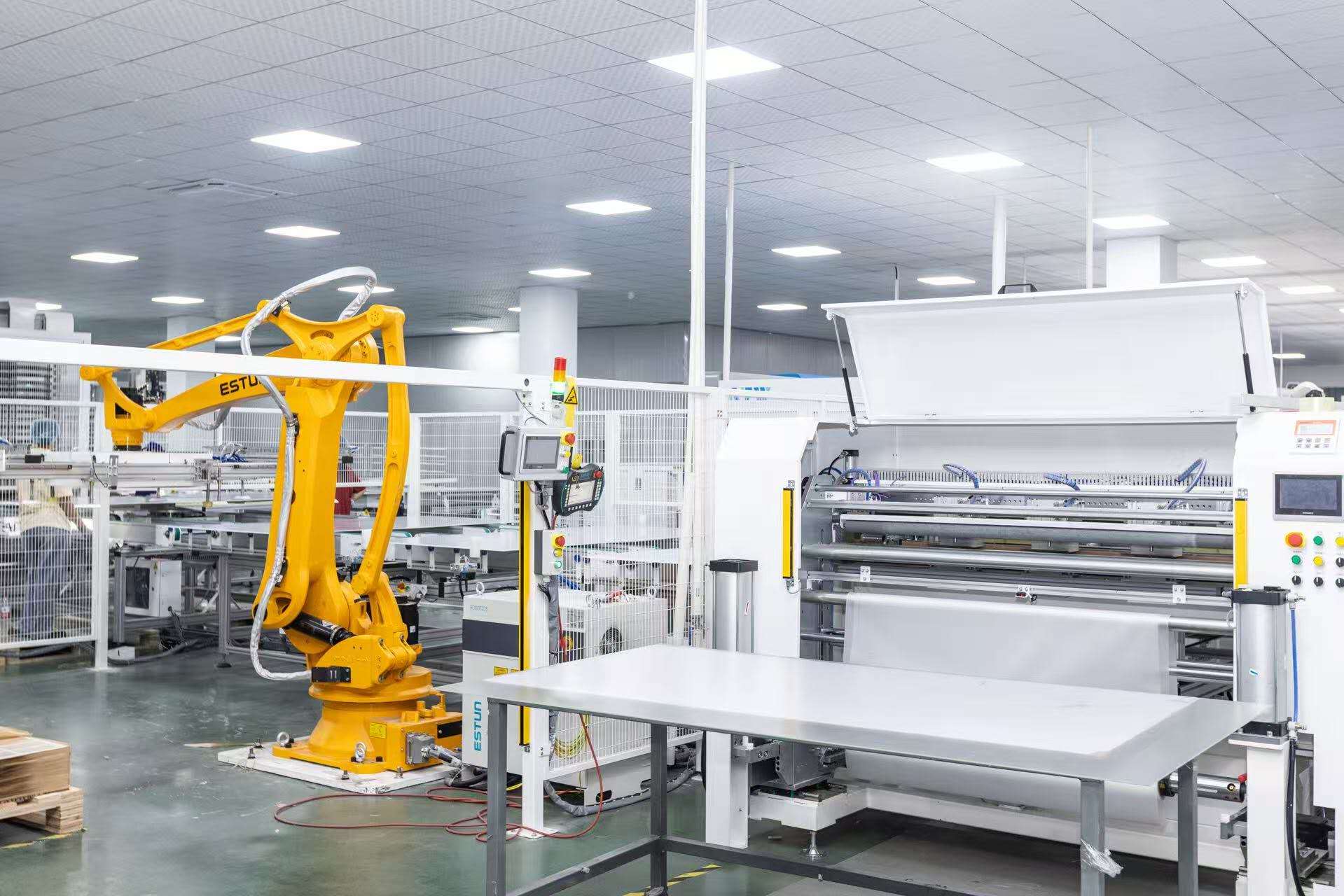 Advanced solar panel manufacturing and lamination equipment inside the factory